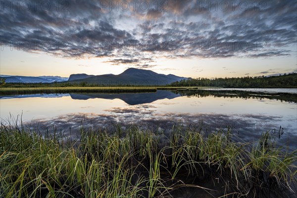 Mountains reflected in small lake