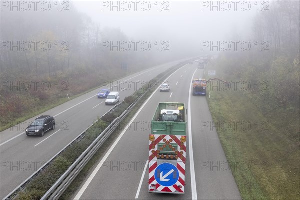 Escort vehicle for protection during mowing work on motorway in autumn