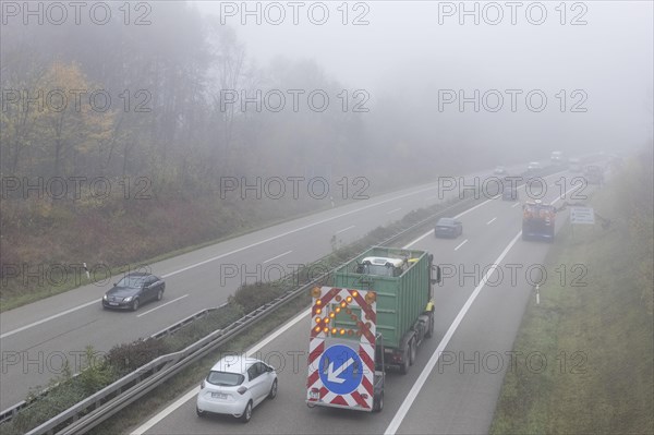 Escort vehicle for protection during mowing work on motorway in autumn