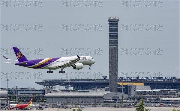 Air traffic control tower Suvarnabhumi Airport and Thai Airways Airbus A300-600 aircraft