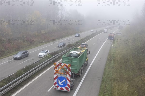 Escort vehicle for protection during mowing work on motorway in autumn