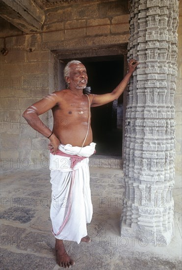 Temple priest standing Kampaheswarar temple in Thirubuvanam near Kumbakonam