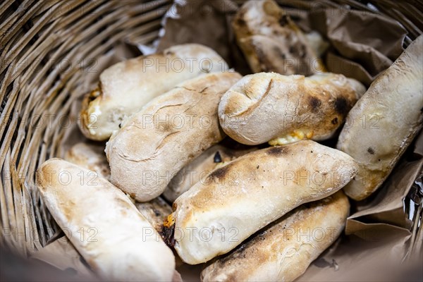 Traditional bread rolls with cheese and chorico meat baked in wood-fired oven