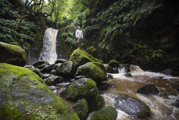 Hiker standing by the Salto do Prego waterfall