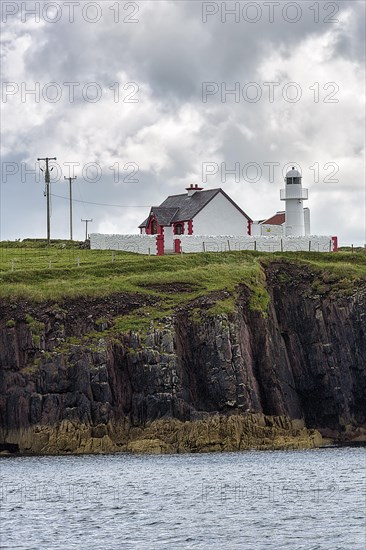 White Lighthouse on High Cliffs