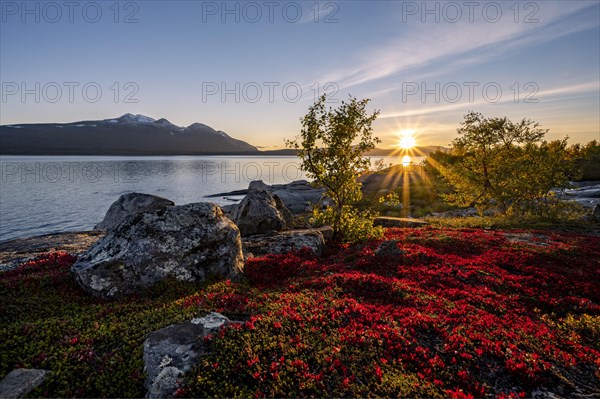 Autumnal fell landscape with lake Akkajaure and mountain range Akka