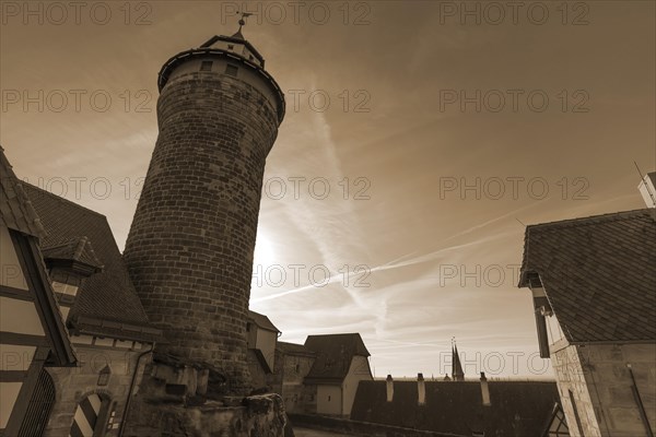 Sinwell Tower on the Kaiserburg in the backlight