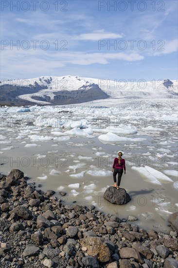 Woman in front of Fjallsarlon ice lagoon