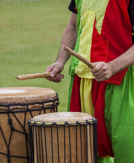 Musicians playing on an African djembe