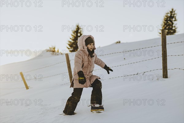 Girl trudging in the snow