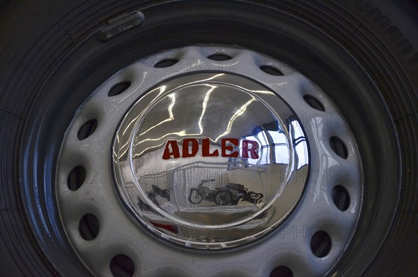 Reflection of motorbike in hubcap of car in Museum Neue Sammlung