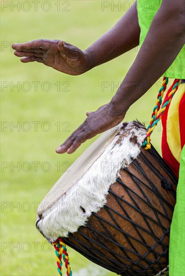 Musicians playing on an African djembe
