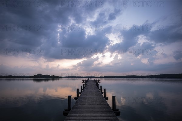 Footbridge into the Woerthsee shortly in front of sunrise
