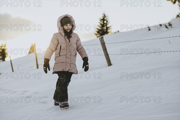 Girl trudging in the snow