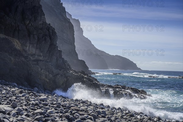 The beach framed by rocks at Playa del Trigo