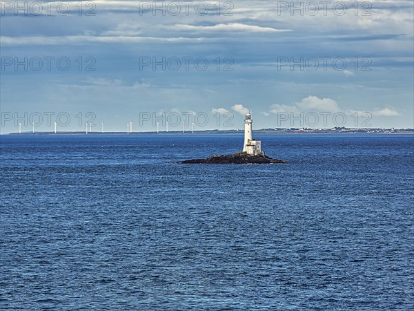 Tuskar Rock Lighthouse on small rocky island