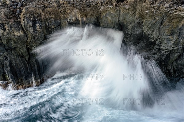 Surf at rocky lava coast