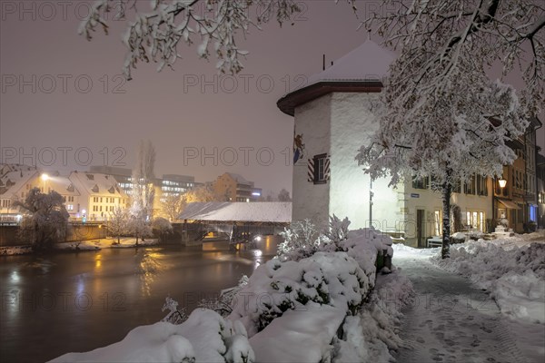 Objective tower and wooden bridge over the Aare