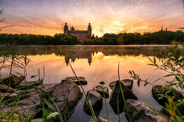 Johannisburg Castle reflected in the Main