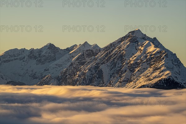 Winter mountain landscape with closed fog cover over the Inn valley