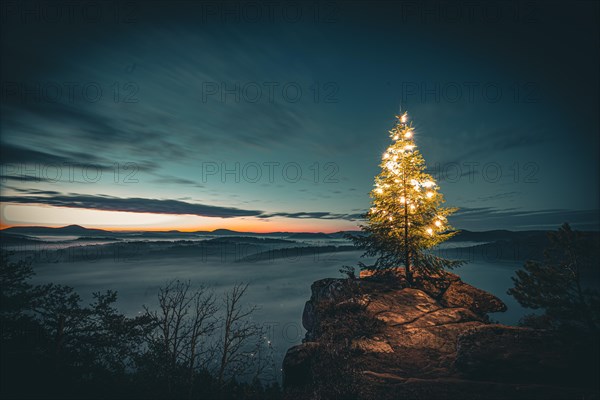 View from the sandstone rock Wachtfelsen to the sunrise