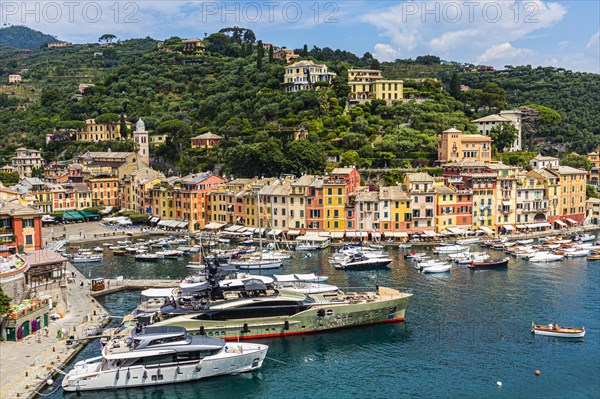 Luxury yachts anchor in the harbour of Portofino