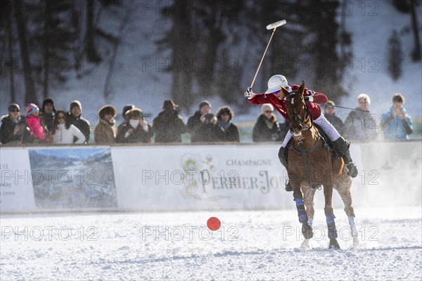 Robert Strom of Team St. Moritz hits the ball