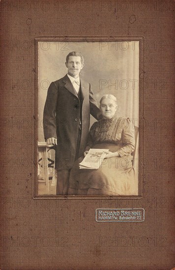 Historical photo of elderly couple around 1920