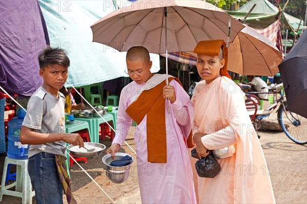 Female monks with begging bowl