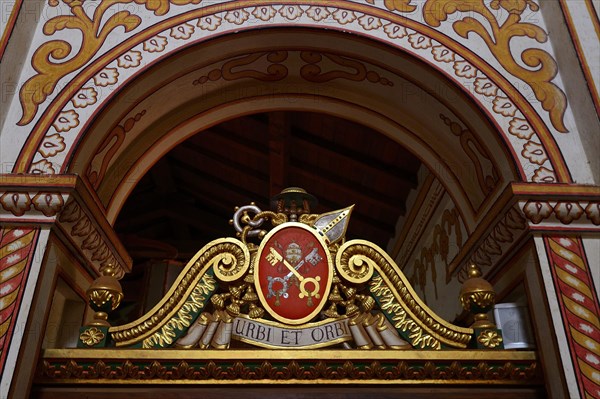 Coat of arms and motto of the Vatican in the mission church Catedral Inmaculada