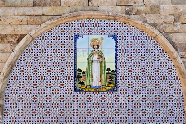 Tiled round arch with depiction of Saint Gregory