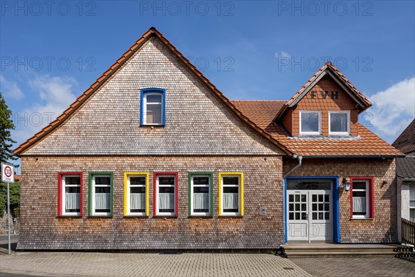 Restored clapboard house made of wooden shingles