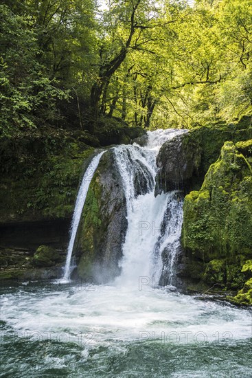 Waterfall and mossy rocks