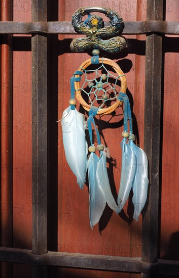 Andalusian lucky charm Indalo and dream catcher on front door