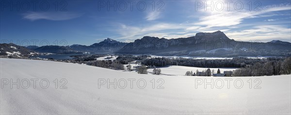 View of snow-covered Mondseeland with Schafberg and Drachenwand