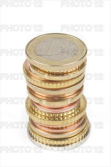 Stack of cent coins and euro coins