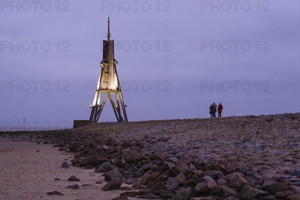 Illuminated Kugelbake at blue hour
