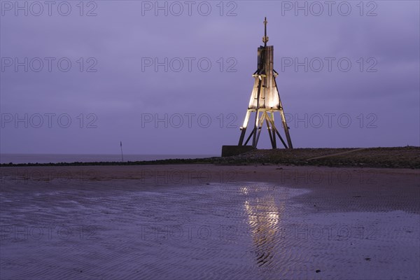 Illuminated Kugelbake at blue hour