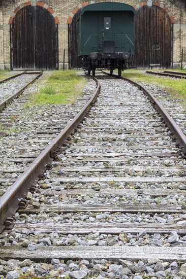 Railway line with an old railway carriage