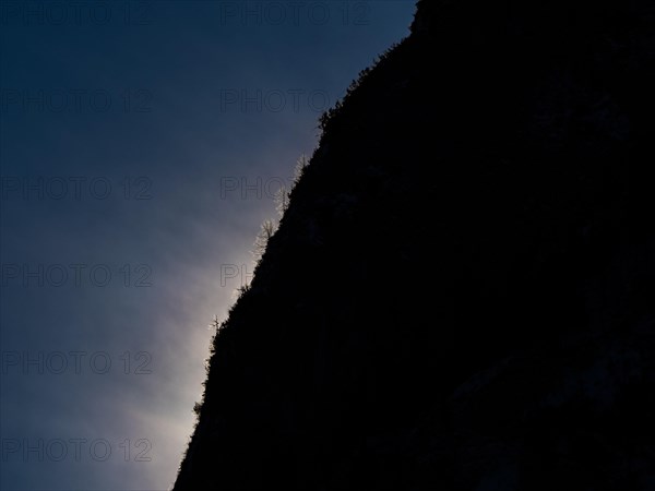 Clouds over mountain silhouette