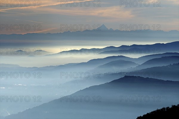 View from Pizzoni di Laveno on silhouettes of mountain ranges with Monte Viso in the distance