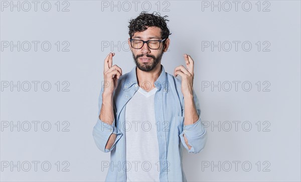 Happy man making a wish