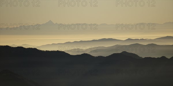 View from Pizzoni di Laveno on silhouettes of mountain ranges with Monte Viso in the distance