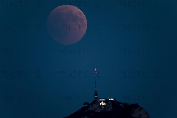 Lunar eclipse above the mountain station of Hohen Kasten