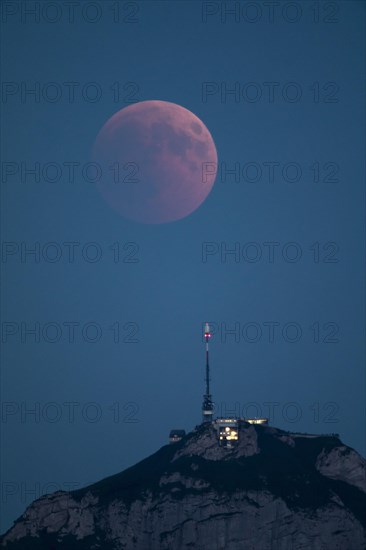 Lunar eclipse above the mountain station of Hohen Kasten