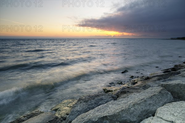 Morning atmosphere with light wind and waves Bank stabilisation in the harbour of Guettingen