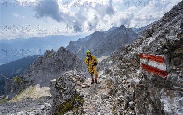 Hiker on hiking trail to Lamsenspitze