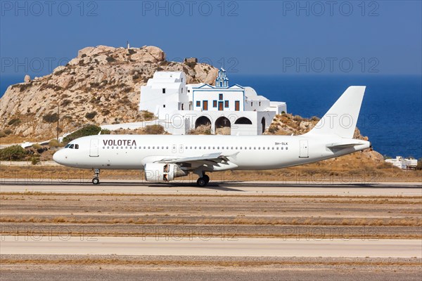 A Volotea Airbus A320 aircraft with registration number 9H-SLK at Santorini airport