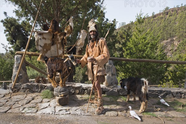 Goat herder in traditional garb