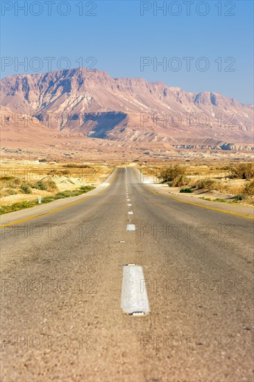 Endless straight road through the desert